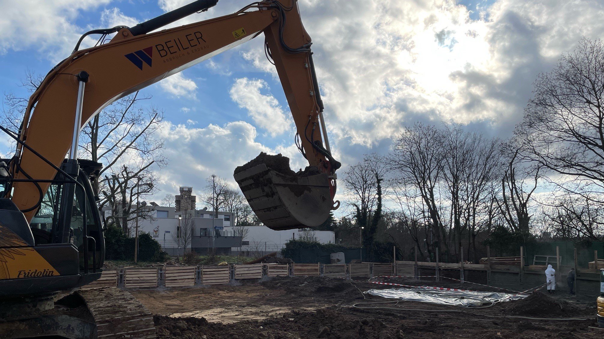 Photo of an excavator at the new building site